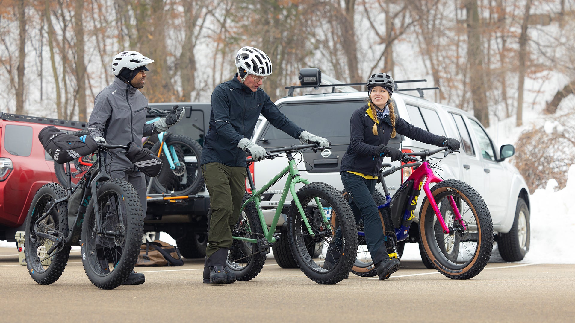 Three fat bikers ready to ride snowy trails wearing 45NRTH gear