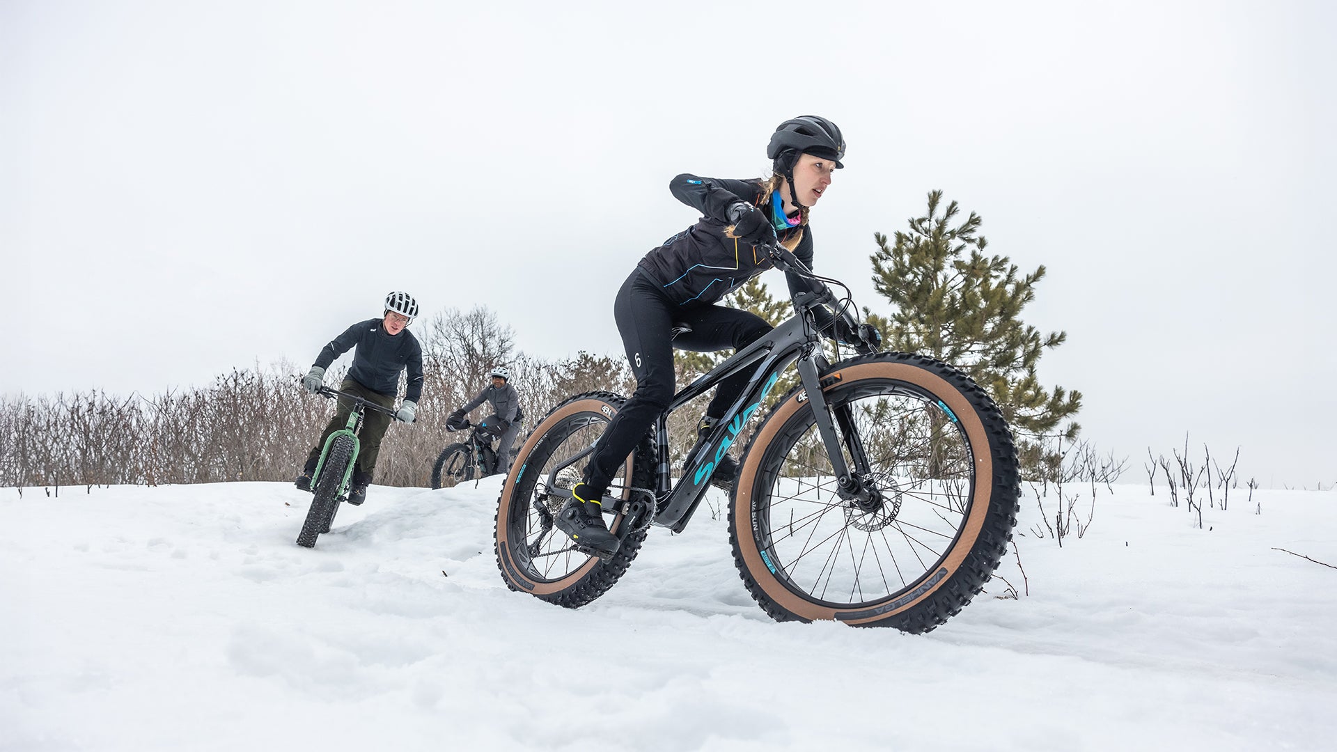 Three fat bikers on snowy trail riding 45RTH Fat Bike Tires