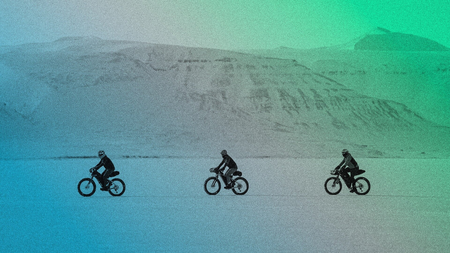 Three cyclists bike across a wintery tundra. A green to blue gradient is layered on the image.