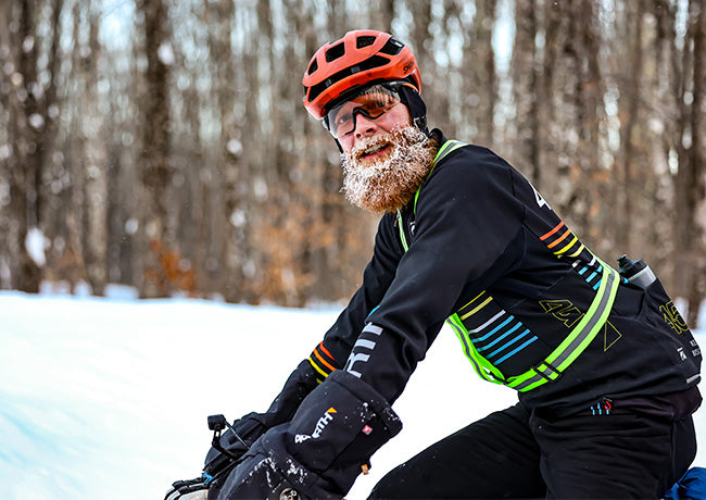 Matt Acker riding fat bike on snow icicles on beard and face