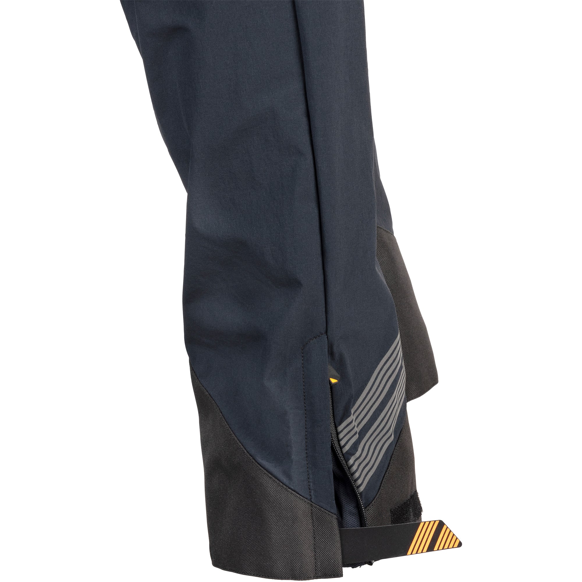 45NRTH Women's Naughtvind Pants view of pant cuff with abrasion reinforcement, Velcro strap to tighten, and reflective lines
