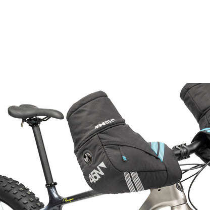 45nrth Cobrafist Pogies - Black - Front three quarter view on handlebars